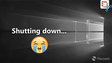 A black and white Windows 10 desktop screen with shutting down written next to it and a crying emoji